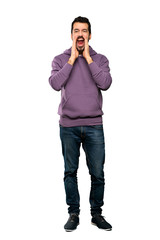 Wall Mural - Full-length shot of Handsome man with sweatshirt shouting and announcing something over isolated white background