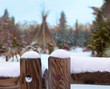 © wewi-creative - In the north of Finland near the town of Kemi is a Native American village. In the background a tent and a reindeer in the snow. In the foreground a wooden fence on which fresh snow lies.