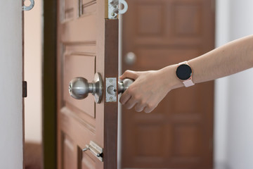 Wall Mural - Women hand open door knob or opening the door,grand opening,Close up hand open door.