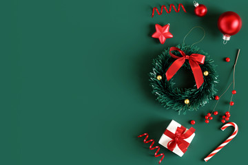 Wall Mural - Christmas decorations on green background. 3d rendering