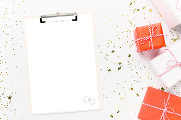 Sticker - Clipboard for wishes on white background with colorful presents