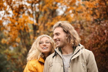 Sticker - Young couple in park on autumn day