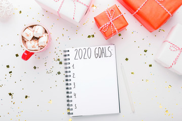Sticker - New year achievements. 2020 goals handwriting in notebook