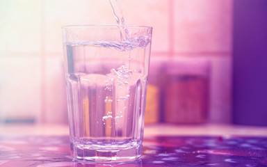 Glass of pure water on kitchen table