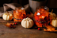 Autumn Lantern Jars Decorated With Colorful Leaves And Heather Wreath