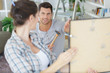 © auremar - couple looking over custom bedroom design drawing photo