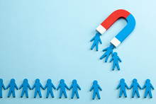 Personnel Recruitment And A Magnet Attracts Good Employee Leaders. Blue Background