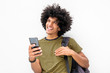 © mimagephotos - happy cool young guy with bag and cellphone smiling on isolated white background
