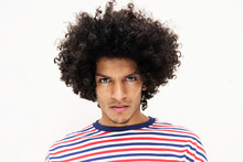 Close Up Front Portrait Handsome Young North African Man With Afro Hairstyle And Serious Face Expression By Isolated White Background