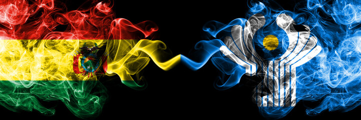 Bolivia, Bolivian vs Commonwealth smoky mystic states flags placed side by side. Concept and idea thick colored silky abstract smoke flags