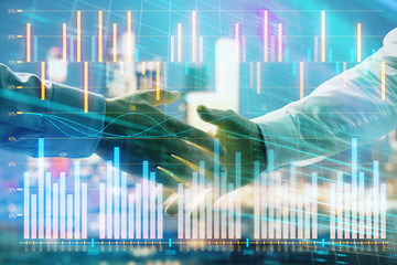 Double exposure of financial chart on cityscape background with two businessmen handshake. Concept of financial analysis and investment opportunities