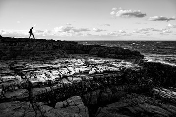 Wall Mural - Scenic evening winter scenic on the Adriatic sea coast in Polignano a Mare, Bari Province, Puglia region,  southern Italy. Black and white image.