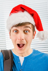 Canvas Print - Surprised Young Man in Santa Hat