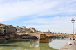 View to St Trinity Bridge river arno and beautiful medieval buildings in florence, Italy