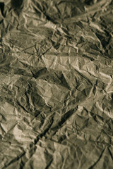 Texture of crumpled brown paper. Rough paper background for design. Abstract texture and background made with wrinkled paper.