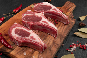 Raw Lamb Chops, Mutton Cuts or Sheep Ribs on Black