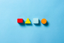 Children's Educational Toys Geometric Shapes For Logic On A Blue Background. The Concept Of Education, Child Development, Logic And Ingenuity. Flat Lay, Top View