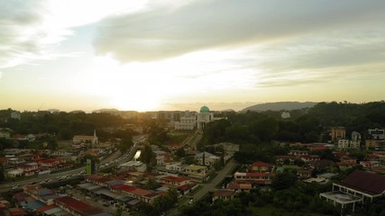 Wall Mural - 4K Aerial footage of beautiful sunset on Kota Kinabalu City, Sabah, Malaysia