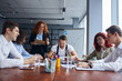 © alfa27 - Young caucasian team of business partners coworking in office together, gathered to discuss. Professional occupation concept