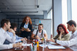 © alfa27 - Business co-workers work together in business office, conference office, wearing formal wear and sit discussing. Caucasian business people