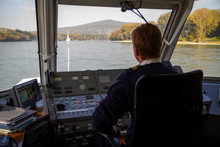 Bratislava, Slovakia. 2019/10/13. A Helmsman Pilots A Ship On The River Danube.