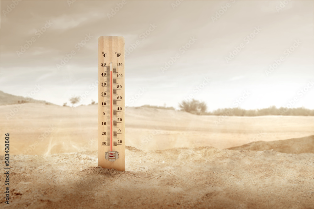 Thermometer with high temperature on the desert with sunlight background - obrazy, fototapety, plakaty 