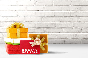 Wall Mural - Pile of colorful gift box with ribbon and Boxing Day Sale text