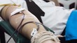 © pairhandmade - Volunteer man giving blood donation to cross red organisation - people with blood donation concept