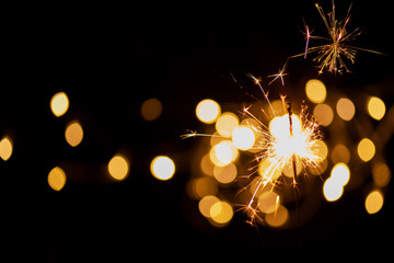sparkler and light bokeh background.abstract and brightly colorful firework in the celebration and a