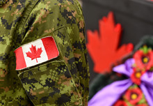 Canada Day. Flag Of Canada On The Military Uniform And Red Maple Leaf On The Background. Canadian Soldiers. Army Of Canada. Canada Leaf. Remembrance Day. Poppy Day.