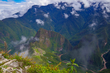 Machu Picchu, legendary Inka capital Peruvian Andes. Historic and ancient ruins and stonewalls high in the mountains. UNESCO world cultural heritage, new wonder of the world and tourist destination