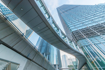 Fototapete - Modern office building and pedestrian walkway in Hong Kong city