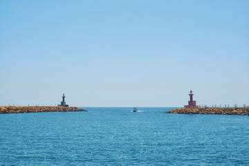 Wall Mural - Harbor entrance at the port lighthouse-Tunisia, Sousse, El Kantaoui 06 19 2019