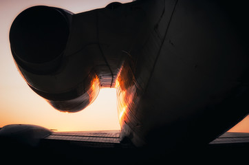 Wall Mural - silhouette fragment turbine and wing of a large airliner