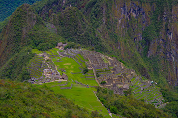 Machu Picchu, legendary Inka capital Peruvian Andes. Historic and ancient ruins and stonewalls high in the mountains. UNESCO world cultural heritage, new wonder of the world and tourist destination