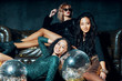 © GVS - Pretty multiethnic young women posing and relaxed after party, lying down on the floor and sofa