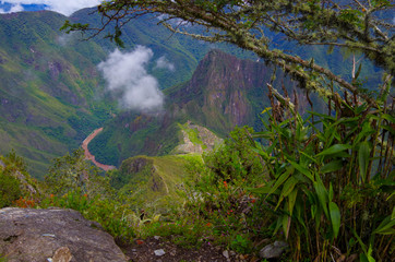 Machu Picchu, legendary Inka capital Peruvian Andes. Historic and ancient ruins and stonewalls high in the mountains. UNESCO world cultural heritage, new wonder of the world and tourist destination