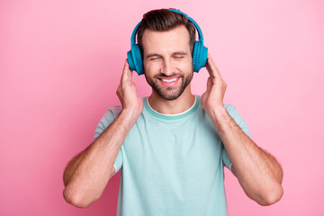 Sticker - Peaceful positive modern man have blue wireless headset listen music enjoy song melody close eyes feel pleasure wear casual style clothes isolated over pastel color background