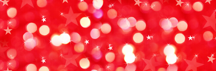 Wall Mural - Shiny Christmas panoramic background of red holiday lights with bokeh and stars