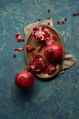 Wall Mural - Pomegranate ripe on metal platter, food