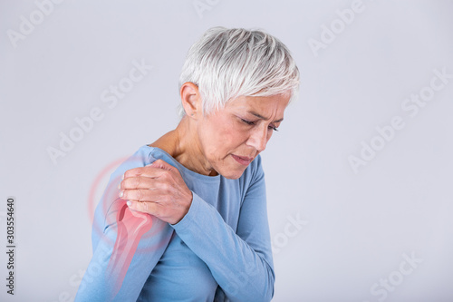 Senior woman with shoulder pain. Elderly woman is enduring awful ache. Shoulder Pain In An Elderly Person. Senior lady with shoulder pain