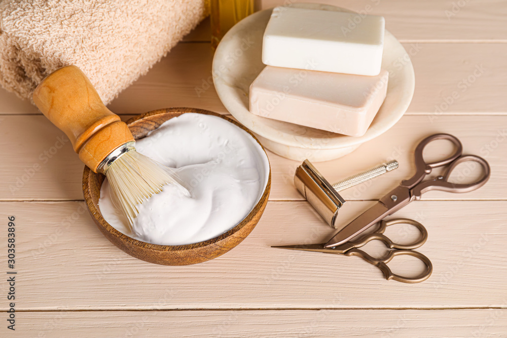 Set for male shaving on white wooden table
