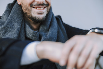 Caucasian guy is posing for camera outdoors