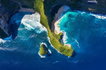 Wall Mural - Aerial view at sea and rocks. Azure water background from top view. Kelingking beach, Nusa Penida, Bali, Indonesia. Travel Asia - image