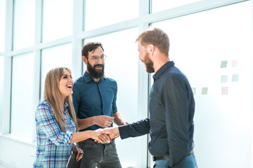 Wall Mural - group of business people with documents standing in the office corridor.