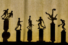 Sports Trophies Silhouettes Through Curtains