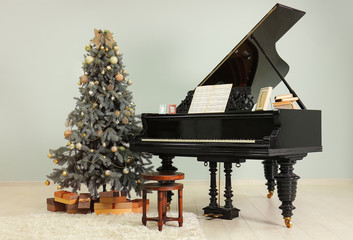 Grand piano in room decorated for Christmas