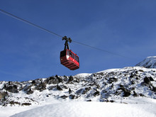 Red Cable Car In The Way To Mountain Top