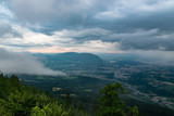 Fototapeta Natura - Landscape view from the Le Signal des Voirons viewpoint, view of dark low clouds and rain over the city of Geneva.Department Haute-Savoie in France.