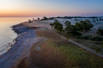 Wall Mural - Stone wall on the Baltic sea in the summer. Osmussaar coast, island in Estonia, Europe.